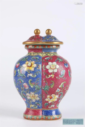 AN ENAMELED CONJOINED PORCELAIN JAR WITH LID.