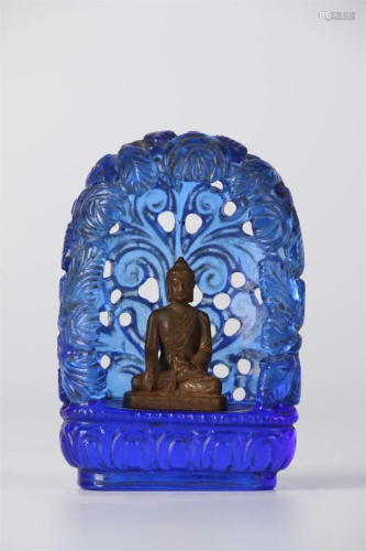 A BLUE GLASS BUDDHIST NICHE WITH BUDDHA STATUE.