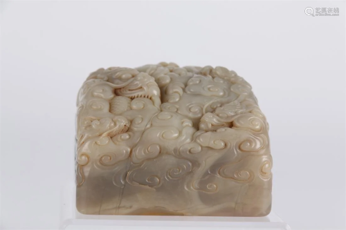 A SHOUSHAN STONE SEAL WITH DRAGON DESIGN.