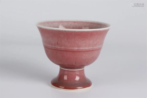 A COWPEA-RED GLAZED PORCELAIN CUP.