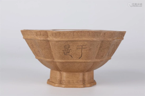 A HEXAGONAL PURPLE CLAY BOWL WITH POEM DESIGN.