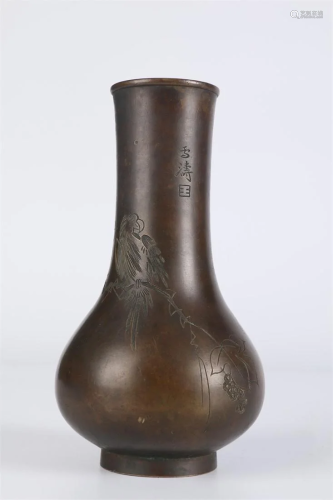 A Bronze BOTTLE WITH FLOWERS AND BIRDS DESIGN.