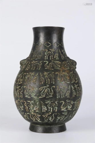 A Bronze BOTTLE WITH ANIMALS DESIGN, TWO EARS.