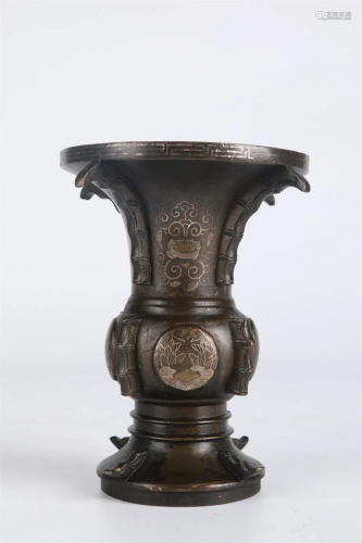 A Bronze FLOWER RECEPTACLE WITH SILVER INLAY.