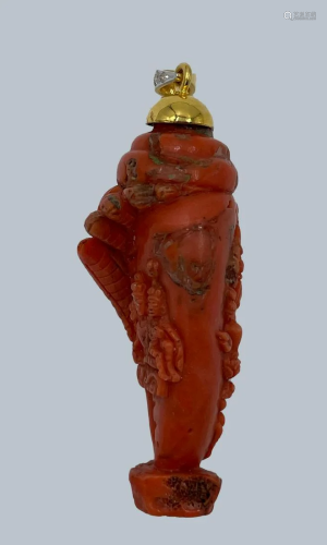 A Carved Coral Pendant