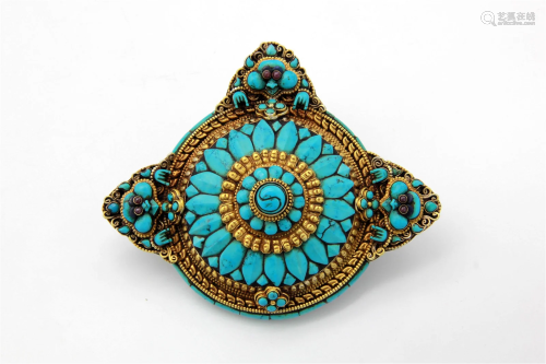 A Tibetan Mooneater Brooch with Three Faces