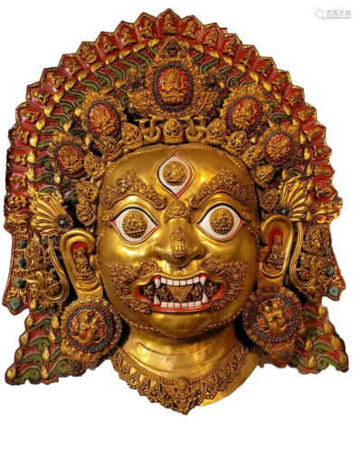 A Gilt copper RepoussÃ© Bhairava Mask