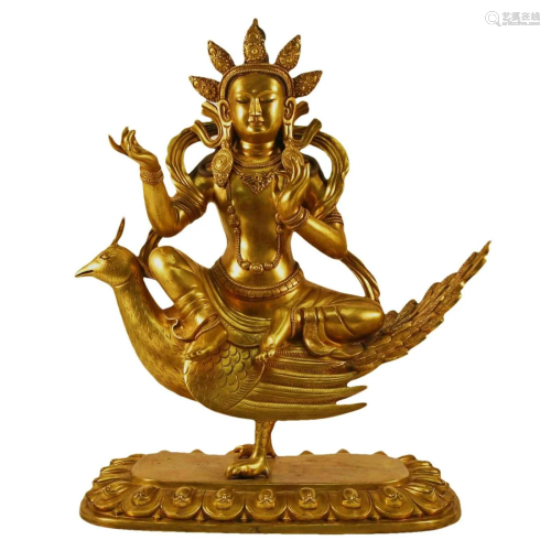 A Gilt-Bronze Figure Of Bodhisattva Seated On A Phoenix