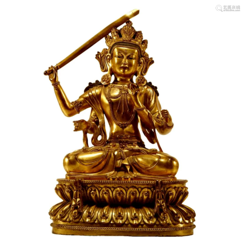A Gilt-Bronze Figure Of Four-Armed Manjusri