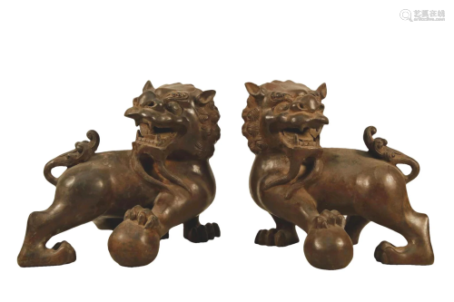 A Pair Of Bronze Lions