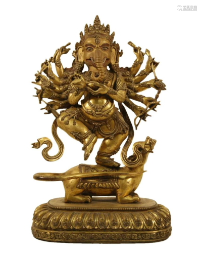 A Gilt-Bronze Figure Of Jambhala With An Elephant's Tru...