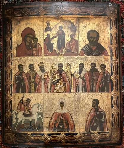 A Russian Icon depicting The Virgin & Child & Saints...