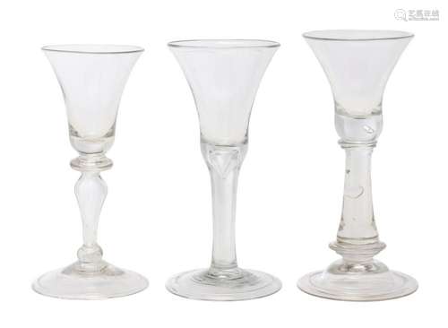 THREE ENGLISH GLASSES WITH BELL BOWLS Early 18th century and...