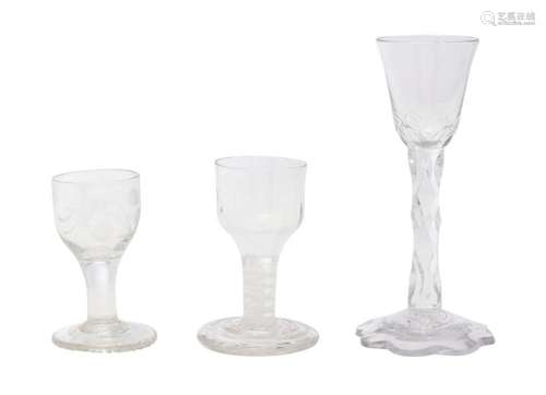 A FACET STEM WINE GLASS AND TWO SMALL WINE GLASSES 18th cent...