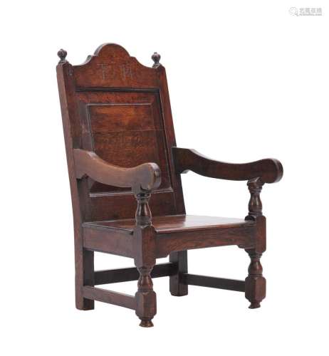 AN ENGLISH OAK CHILD S PANEL BACK ARMCHAIR Early 18th centur...