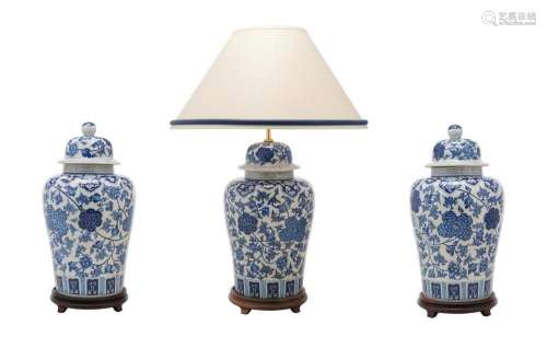 A CHINESE BLUE AND WHITE PORCELAIN LAMP AND VASE GARNITURE 2...