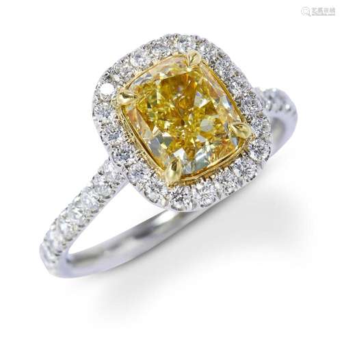 FANCY LIGHT YELLOW DIAMOND AND DIAMOND RING