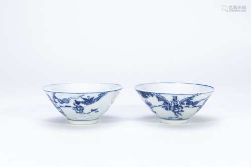 A pair of blue and white character bowls