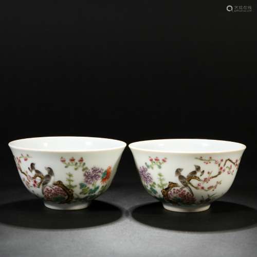 A pair of pastel flower and bird cups