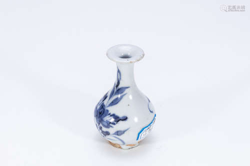 blue and white flower vial