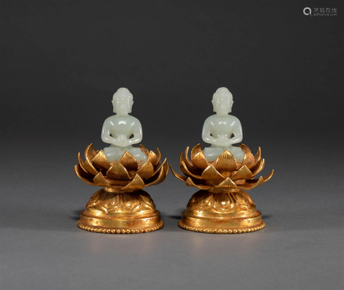 A pair of gilded lotus and jade Buddha