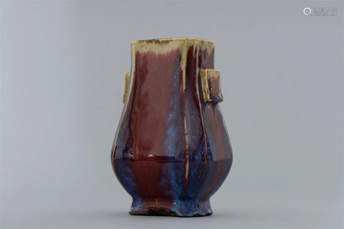 Qing Dynasty kiln red glaze pierced ear bottle