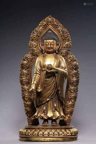 QING, GILT BRONZE OF SAKYAMUNI WITH AUREOLE