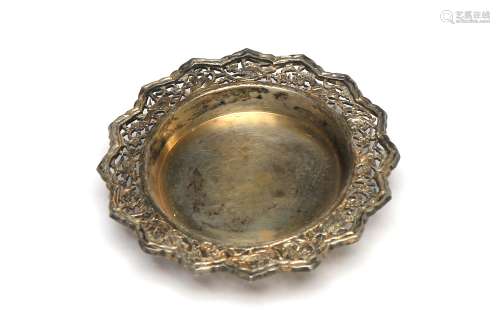 A carved and repousse' silver small tray decorated with...