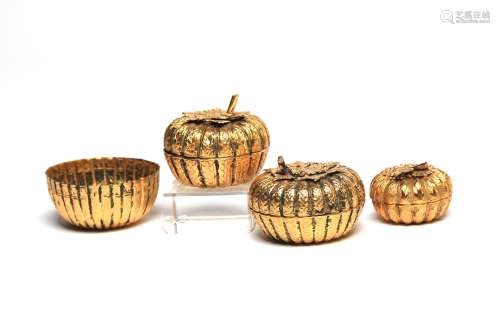 Four gilded silver betel nut set covered boxes decorated and...