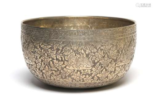 A carved and repousse' silver bowl decorated in relief ...