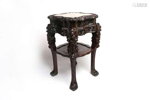 A flower-shaped wooden stand, with inset marble top carved w...
