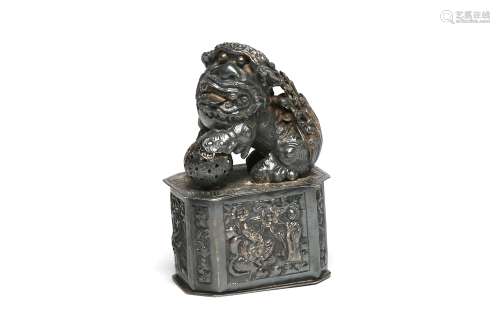 A carved and repousse' silver box in the shaped of lion