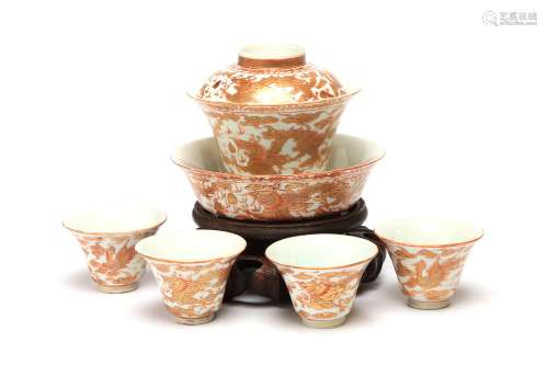 A polychrome porcelain tea set comprising of four teacups, a...