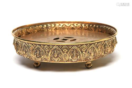 A silver gilt tray decorated in relief with Theppanom and Ga...