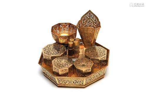 A fine silver gilt betel nut set decorated with floral vine ...