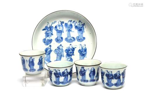 A blue and white porcelain tea set comprising four teacups a...