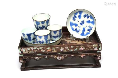 A blue and white porcelain tea set painted with goldfish ami...