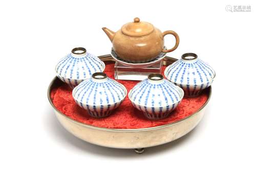 A blue and white porcelain tea set painted to interior and e...