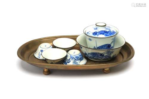 A blue and white porcelain tea set comprising of four teacup...