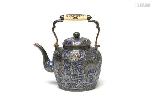 A carved and repousse' silver enameled teapot decorated...