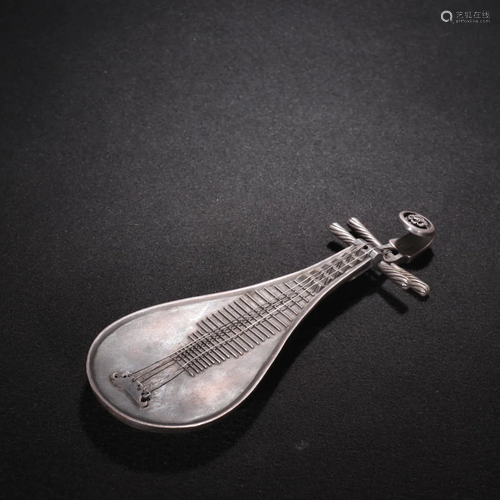 A Rare Silver Carved Lute Ornament