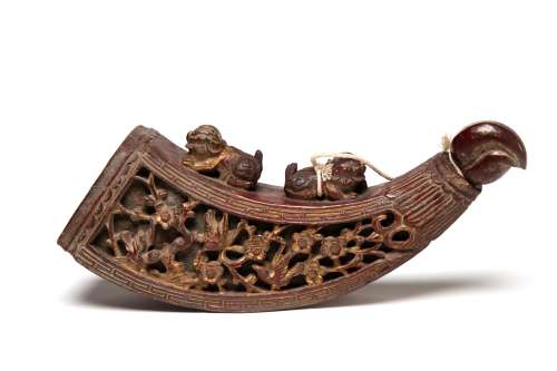 A wooden gun powder container carved with birds and flowers ...
