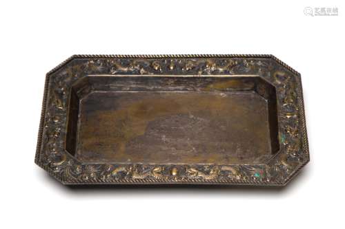 A brass tray decorated with dragon amidst clouds