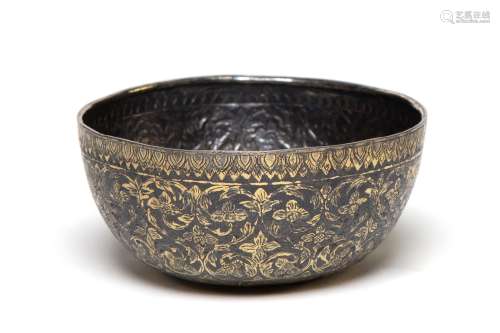 A gilded silver niello bowl decorated with trailing flowers ...