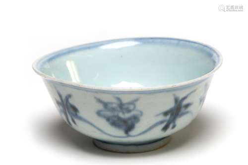A blue and white porcelain Ming bowl painted with scrolling ...