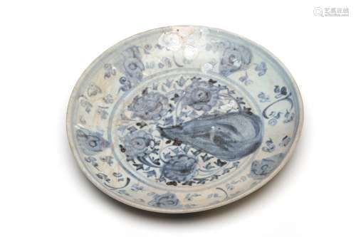 A blue and white porcelain Ming dish painted with scrolling ...