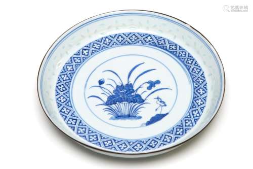 A blue and white porcelain tray painted with lotus flowers