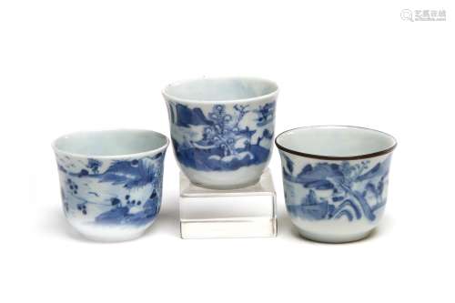 Three blue and white porcelain teacups painted with landscap...