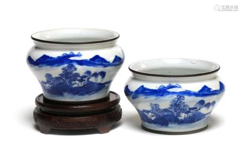 A pair of blue and white porcelain spittoons painted with a ...