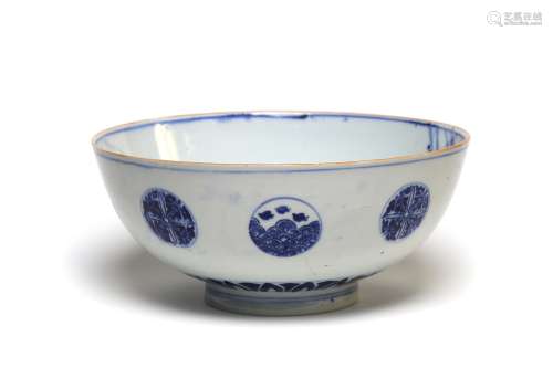 A blue and white porcelain basin painted with flowers in the...